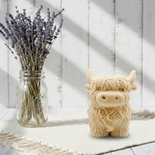Load image into Gallery viewer, Large handmade vegan soap in the shape of a fluffy Highland cow calf with a detailed, shaggy coat, displayed against a whimsical farmhouse decor background.