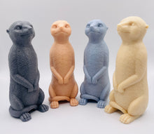 Load image into Gallery viewer, Handmade vegan soaps featuring a cheeky meerkat standing on his back legs. packaged in beautiful eco friendly packaging crafted with natural French clays, activated charcoal and essential oils. a eco-friendly, zero waste gift that’s cruelty-free, skin-nourishing, and perfect for meerkat lovers and animal themed gifts. small business UK
