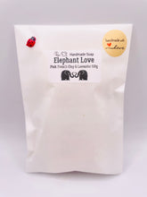 Load image into Gallery viewer, Handmade vegan soaps featuring two elephants who's trunks meet in a heart shape packed in beautiful eco friendly packaging. crafted with natural French clays, activated charcoal and essential oils. a eco-friendly, zero waste gift thatās cruelty-free, skin-nourishing, and perfect for elephant lovers or animal themed gifts. Small business UK