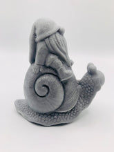 Load image into Gallery viewer, Handmade vegan soaps featuring a detailed snail with a gnome catching a ride on his back soap. crafted with natural French clays, activated charcoal and essential oils. a eco-friendly, zero waste gift that’s cruelty-free, skin-nourishing, and perfect for turtle lovers and gnome lover gifts. small business UK