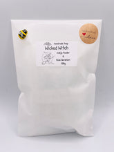 Load image into Gallery viewer, Handmade vegan soaps featuring a witch flying on her broomstick. crafted with natural French clays, activated charcoal and essential oils. a eco-friendly, zero waste gift thatās cruelty-free, skin-nourishing, and perfect for witch gifts and Halloween gifts. Small business UK