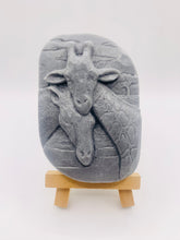 Load image into Gallery viewer, Handmade vegan soaps featuring two nuzzling giraffes in beautiful eco friendly packaging. crafted with natural French clays, activated charcoal and essential oils. a eco-friendly, zero waste gift thatās cruelty-free, skin-nourishing, the perfect gift for giraffe lovers, or for animal lover gifts. small business UK