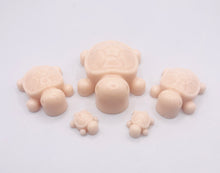 Load image into Gallery viewer, Handmade vegan soaps featuring a set of 5 turtle family soaps and gift boxed in beautiful eco friendly packaging crafted with natural French clays, activated charcoal and essential oils. a eco-friendly, zero waste gift that’s cruelty-free, skin-nourishing, and perfect for turtle lovers and animal themed gifts. small business UK