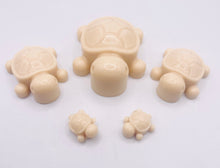 Load image into Gallery viewer, Handmade vegan soaps featuring a set of 5 turtle family soaps and gift boxed in beautiful eco friendly packaging crafted with natural French clays, activated charcoal and essential oils. a eco-friendly, zero waste gift that’s cruelty-free, skin-nourishing, and perfect for turtle lovers and animal themed gifts. small business UK