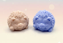 Load image into Gallery viewer, Handmade vegan soaps featuring a cute waving hedgehog, packaged in beautiful eco friendly packaging. crafted with natural French clays, activated charcoal and essential oils. a eco-friendly, zero waste gift that’s cruelty-free, skin-nourishing, the perfect gift for hedgehog lovers and animal lovers. small business UK