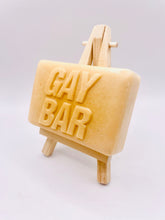 Load image into Gallery viewer, Handmade vegan soaps featuring the wording GAY BAR novelty gift. crafted with natural French clays, activated charcoal and essential oils. a eco-friendly, zero waste gift that’s cruelty-free, skin-nourishing, and perfect for pride gifts and LGBTQ gifts, hen party favours. wrapped in beautiful eco friendly packaging.