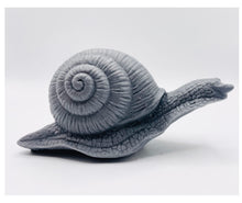 Load image into Gallery viewer, Handmade vegan soaps featuring a detailed snail, in beautiful eco friendly packaging. crafted with natural French clays, activated charcoal and essential oils. a eco-friendly, zero waste gift that’s cruelty-free, skin-nourishing, the perfect gift for snail lovers, gardeners or for animal lovers. small business UK