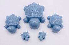 Load image into Gallery viewer, Handmade vegan soaps featuring a set of 5 turtle family soaps and gift boxed in beautiful eco friendly packaging crafted with natural French clays, activated charcoal and essential oils. a eco-friendly, zero waste gift that’s cruelty-free, skin-nourishing, and perfect for turtle lovers and animal themed gifts. small business UK