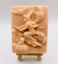 Load image into Gallery viewer, Handmade vegan soaps featuring a witch flying on her broomstick. crafted with natural French clays, activated charcoal and essential oils. a eco-friendly, zero waste gift thatās cruelty-free, skin-nourishing, and perfect for witch gifts and Halloween gifts. Small business UK