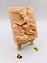 Load image into Gallery viewer, Handmade vegan soaps featuring a witch flying on her broomstick. crafted with natural French clays, activated charcoal and essential oils. a eco-friendly, zero waste gift thatās cruelty-free, skin-nourishing, and perfect for witch gifts and Halloween gifts. Small business UK