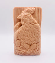 Load image into Gallery viewer, Handmade vegan soaps featuring a chicken sat on her nest of eggs, in beautiful eco friendly packaging. crafted with natural French clays, activated charcoal and essential oils. a eco-friendly, zero waste gift that’s cruelty-free, skin-nourishing, the perfect gift for easter and animal lovers. small business UK