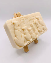 Load image into Gallery viewer, dog lover gift. cat lover gift. animal lover gift. zero waste gift. modern gifts. handmade home style. This beautifully detailed, chunky bar features a line-up of our loyal four-legged friends, reminding us of the love, joy, and muddy footprints they bring into our lives. The one in the photo is made with charcoal and lavender essential oil, soothing, earthy, and perfect for washing the day away (or after a long dog walk!). eco conscious home. eco conscious living.