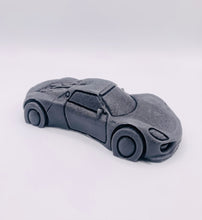 Load image into Gallery viewer, Handmade vegan soaps featuring a sports car wrapped in beautiful eco friendly packaging crafted with natural French clays, activated charcoal and essential oils. a eco-friendly, zero waste gift that’s cruelty-free, skin-nourishing, and perfect gift for sports car lovers and gifts for him. small business UK