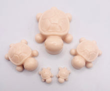 Load image into Gallery viewer, Handmade vegan soaps featuring a set of 5 turtle family soaps and gift boxed in beautiful eco friendly packaging crafted with natural French clays, activated charcoal and essential oils. a eco-friendly, zero waste gift that’s cruelty-free, skin-nourishing, and perfect for turtle lovers and animal themed gifts. small business UK