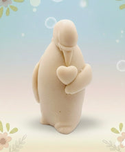 Load image into Gallery viewer, Handmade vegan soaps featuring a penguin holding a love heart packaged in beautiful eco friendly packaging crafted with natural French clays, activated charcoal and essential oils. a eco-friendly, zero waste gift that’s cruelty-free, skin-nourishing, and perfect for penguin lovers, christmas gifts and animal themed gifts. small business UK