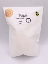 Load image into Gallery viewer, Handmade vegan soaps featuring a chunky penguin wrapped in beautiful eco friendly packaging crafted with natural French clays, activated charcoal and essential oils. a eco-friendly, zero waste gift that’s cruelty-free, skin-nourishing, and perfect for christmas gifts and penguin lovers. small business UK