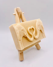 Load image into Gallery viewer, Handmade vegan soaps featuring two elephants who's trunks meet in a heart shape packed in beautiful eco friendly packaging. crafted with natural French clays, activated charcoal and essential oils. a eco-friendly, zero waste gift thatās cruelty-free, skin-nourishing, and perfect for elephant lovers or animal themed gifts. Small business UK