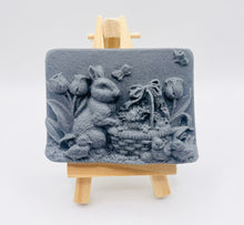 Load image into Gallery viewer, Handmade vegan soaps featuring the easter bunny with a basket full of chicks. , in beautiful eco friendly packaging. crafted with natural French clays, activated charcoal and essential oils. a eco-friendly, zero waste gift that’s cruelty-free, skin-nourishing, the perfect gift for easter and animal lovers. small business UK
