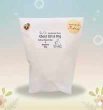 Load image into Gallery viewer, Handmade vegan soaps shaped as a cute ghost girl walking a dog. crafted with natural French clays, activated charcoal and essential oils. a eco-friendly, zero waste gift that’s cruelty-free, skin-nourishing, and perfect for Halloween and gifting. Small business UK.