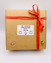 Load image into Gallery viewer, Handmade vegan soaps featuring a set of three little cat faces gift boxed in beautiful eco friendly packaging. crafted with natural French clays, activated charcoal and essential oils. a eco-friendly, zero waste gift that’s cruelty-free, skin-nourishing, the perfect gift for cat lovers or animal lovers. small business UK