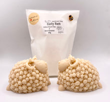 Load image into Gallery viewer, Handmade vegan soaps featuring a detailed curly ram sheep design soaps. crafted with natural French clays, activated charcoal and essential oils. beautifully wrapped in eco friendly packaging. a zero waste gift that’s cruelty-free, skin-nourishing, and perfect for sheep lover gifts and animal lovers. gifts for Easter.