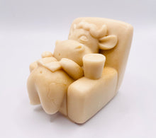 Load image into Gallery viewer, Handmade vegan cow sleeping on the sofa with book and coffee, shaped vegan soaps. crafted with natural French clays, activated charcoal and essential oils. a eco-friendly, zero waste gift that’s cruelty-free, skin-nourishing, and perfect for animal lovers and gifting. small business UK