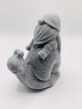 Load image into Gallery viewer, Handmade vegan soaps featuring a detailed snail with a gnome catching a ride on his back soap. crafted with natural French clays, activated charcoal and essential oils. a eco-friendly, zero waste gift that’s cruelty-free, skin-nourishing, and perfect for turtle lovers and gnome lover gifts. small business UK