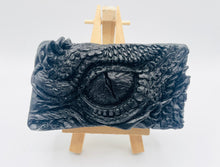 Load image into Gallery viewer, dragon Gift | dragon eye gift, dino gift, alternative gift, Dragon / Dinosaur Eye Vegan Soap Wooden display easels are available to purchase on a separate listing Calling all fantasy lovers! Step into a realm of mystical charm with our captivating dragon / dinosaur eye soap. This soap is vegan, cruelty free and available in your choice of colour and essential oil. All our soaps are made with natural clays and essential oils to gently cleanse and nourish your skin. eco conscious gift