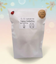 Load image into Gallery viewer, Handmade vegan soaps featuring a cute waving hedgehog, packaged in beautiful eco friendly packaging. crafted with natural French clays, activated charcoal and essential oils. a eco-friendly, zero waste gift that’s cruelty-free, skin-nourishing, the perfect gift for hedgehog lovers and animal lovers. small business UK