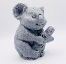 Load image into Gallery viewer, Handmade vegan soaps featuring a chunky koala bear climbing a tree packaged in beautiful eco friendly packaging crafted with natural French clays, activated charcoal and essential oils. a eco-friendly, zero waste gift that’s cruelty-free, skin-nourishing, and perfect for koala bear lovers and animal themed gifts. small business UK