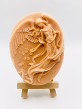 Load image into Gallery viewer, Handmade vegan Guardian Angel soap bar, features a detailed angel with flowing wings. Natural, cruelty-free UK soap ideal for spiritual gifts, zero waste skincare, and sustainable bathroom décor. British-made artisan soap perfect for eco-conscious shoppers. Wrapped in beautiful eco friendly packaging . Small business UK
