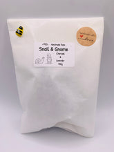 Load image into Gallery viewer, Handmade vegan soaps featuring a detailed snail with a gnome catching a ride on his back soap. crafted with natural French clays, activated charcoal and essential oils. a eco-friendly, zero waste gift that’s cruelty-free, skin-nourishing, and perfect for turtle lovers and gnome lover gifts. small business UK