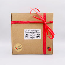 Load image into Gallery viewer, Christmas Themed Vegan Hand Soaps Gift Boxed Give the gift of clean hands! This set of six Christmas themed hand soaps make the perfect secret Santa, stocking filler and friendship gifts! Each set contains a Santa, a candy cane, snowflake, gift box, gingerbread man, snowman, and a Christmas tree. (Yes, they’re almost too cute to use… almost.) Available in your choice of French clay and essential oil: modern gifts. zero waste gifts UK. handmade gifts UK. Handmade home style UK. BrIrish made. Handmade UK.