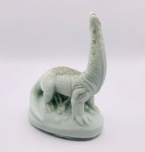 Load image into Gallery viewer, Handmade vegan Brontosaurus dinosaur shaped vegan soaps. crafted with natural French clays, activated charcoal and essential oils. a eco-friendly, zero waste gift that’s cruelty-free, skin-nourishing, and perfect for dragon dinosaur lovers and gifting.