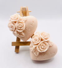 Load image into Gallery viewer, Handmade vegan soaps featuring a set of two love heart soaps with wording I LOVE U with flowers, gift boxed in beautiful eco friendly packaging. crafted with natural French clays, activated charcoal and essential oils. a eco-friendly, zero waste gift that’s cruelty-free, skin-nourishing, and perfect for romantic valentines gifts and anniversary gifts. small business UK