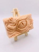 Load image into Gallery viewer, dragon Gift | dragon eye gift, dino gift, alternative gift, Dragon / Dinosaur Eye Vegan Soap Wooden display easels are available to purchase on a separate listing Calling all fantasy lovers! Step into a realm of mystical charm with our captivating dragon / dinosaur eye soap. This soap is vegan, cruelty free and available in your choice of colour and essential oil. All our soaps are made with natural clays and essential oils to gently cleanse and nourish your skin. eco conscious gift