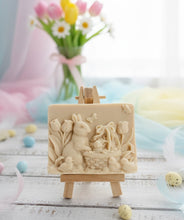Load image into Gallery viewer, Intricate handmade soap scene from Soap Simple Creations featuring an Easter bunny, chicks, and tulips, displayed on a wooden easel with spring flowers. Vegan and cruelty free soap.