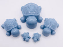 Load image into Gallery viewer, Handmade vegan soaps featuring a set of 5 turtle family soaps and gift boxed in beautiful eco friendly packaging crafted with natural French clays, activated charcoal and essential oils. a eco-friendly, zero waste gift that’s cruelty-free, skin-nourishing, and perfect for turtle lovers and animal themed gifts. small business UK