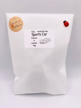 Load image into Gallery viewer, Handmade vegan soaps featuring a sports car wrapped in beautiful eco friendly packaging crafted with natural French clays, activated charcoal and essential oils. a eco-friendly, zero waste gift that’s cruelty-free, skin-nourishing, and perfect gift for sports car lovers and gifts for him. small business UK