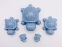 Load image into Gallery viewer, Handmade vegan soaps featuring a set of 5 turtle family soaps and gift boxed in beautiful eco friendly packaging crafted with natural French clays, activated charcoal and essential oils. a eco-friendly, zero waste gift that’s cruelty-free, skin-nourishing, and perfect for turtle lovers and animal themed gifts. small business UK