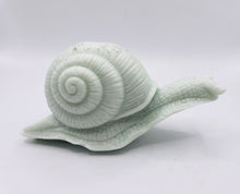 Load image into Gallery viewer, Handmade vegan soaps featuring a detailed snail, in beautiful eco friendly packaging. crafted with natural French clays, activated charcoal and essential oils. a eco-friendly, zero waste gift that’s cruelty-free, skin-nourishing, the perfect gift for snail lovers, gardeners or for animal lovers. small business UK