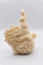 Load image into Gallery viewer, Handmade vegan soaps featuring a gorgeous gnome holding a bunch of flowers in one hand and waving with the other hand. beautiful eco friendly packaging. crafted with natural French clays, activated charcoal and essential oils. a eco-friendly, zero waste gift that’s cruelty-free, skin-nourishing, and perfect for gnome lovers and gifting. UK Small Business