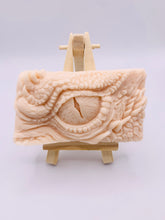 Load image into Gallery viewer, dragon Gift | dragon eye gift, dino gift, alternative gift, Dragon / Dinosaur Eye Vegan Soap Wooden display easels are available to purchase on a separate listing Calling all fantasy lovers! Step into a realm of mystical charm with our captivating dragon / dinosaur eye soap. This soap is vegan, cruelty free and available in your choice of colour and essential oil. All our soaps are made with natural clays and essential oils to gently cleanse and nourish your skin. eco conscious gift