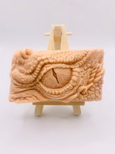 Load image into Gallery viewer, dragon Gift | dragon eye gift, dino gift, alternative gift, Dragon / Dinosaur Eye Vegan Soap Wooden display easels are available to purchase on a separate listing Calling all fantasy lovers! Step into a realm of mystical charm with our captivating dragon / dinosaur eye soap. This soap is vegan, cruelty free and available in your choice of colour and essential oil. All our soaps are made with natural clays and essential oils to gently cleanse and nourish your skin. eco conscious gift