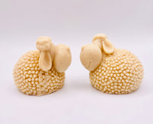 Load image into Gallery viewer, Handmade vegan soap featuring a set of two spring lambs and gift boxed in beautiful eco friendly packaging. crafted with natural French clays, activated charcoal and essential oils. a eco-friendly, zero waste gift that’s cruelty-free, skin-nourishing, and perfect for easter, sheep lovers or animal themed gifts. Small business UK