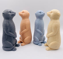 Load image into Gallery viewer, Handmade vegan soaps featuring a cheeky meerkat standing on his back legs. packaged in beautiful eco friendly packaging crafted with natural French clays, activated charcoal and essential oils. a eco-friendly, zero waste gift that’s cruelty-free, skin-nourishing, and perfect for meerkat lovers and animal themed gifts. small business UK