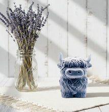 Load image into Gallery viewer, Large handmade vegan soap in the shape of a fluffy Highland cow calf with a detailed, shaggy coat, displayed against a whimsical farmhouse decor background.