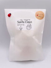 Load image into Gallery viewer, Handmade vegan traditional Santa Claus face shaped vegan soaps. crafted with natural French clays, activated charcoal and essential oils. a eco-friendly, zero waste gift that’s cruelty-free, skin-nourishing, and perfect for Christmas gifts, secret Santa and stocking fillers. Small business UK