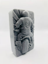 Load image into Gallery viewer, detailed handmade vegan soap gift featuring a motorcycle rider with a skull emblem on their jacket, displayed on a wooden easel against a whimsical farmhouse decor background