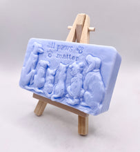 Load image into Gallery viewer, dog lover gift. cat lover gift. animal lover gift. zero waste gift. modern gifts. handmade home style. This beautifully detailed, chunky bar features a line-up of our loyal four-legged friends, reminding us of the love, joy, and muddy footprints they bring into our lives. The one in the photo is made with charcoal and lavender essential oil, soothing, earthy, and perfect for washing the day away (or after a long dog walk!). eco conscious home. eco conscious living.